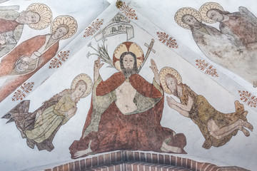 Mural of Christ on the judgment day, with a lily and a sword in his mouth