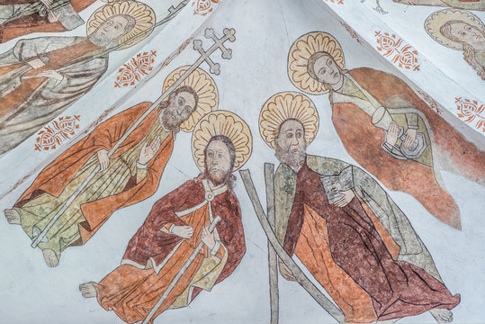Fresco of four apostles with their symbols, Philip, Jacob the elder, Andrew, John the evangelist