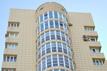 Modern panel apartment building with plastic windows and insulated walls