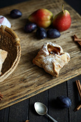 puff pastry with Apple on dark wooden background.