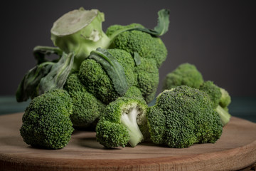 green broccoli on wood table Broccoli. Fresh green broccoli on table. Top view. Free copy space