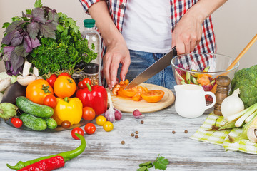 Woman cooks at the kitchen, body part, blurred background