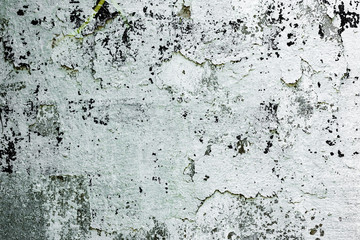 Texture of a concrete wall with cracks and scratches which can be used as a background