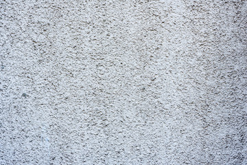Texture of a concrete wall with cracks and scratches which can be used as a background