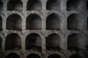 Old ancient winery, niches for wine bottles