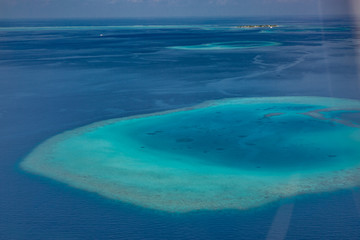 Aerial view of Maldives atolls is the world top beauty. Maldives tourism. Amazing aerial of the beautiful atolls of the Maldives.