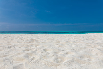 Empty beach landscape seascape. Blue sky over white sand near tropical sea. Exotic island view, summer beach