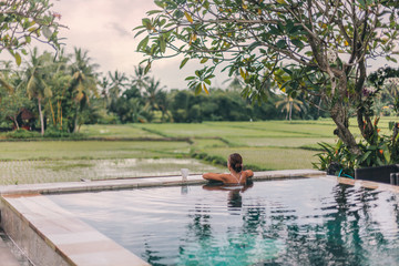 Infinity pool with a view on rice terrace, Ubud, Bali