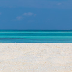 Fototapeta na wymiar Empty tropical beach background. Horizon with sky and white sand with copy space