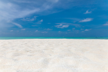 Empty tropical beach background. Horizon with sky and white sand with copy space