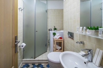 Interior of bathroom in modern apartment. Shower cabin.