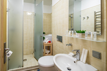 Interior of bathroom in modern apartment. Shower cabin.