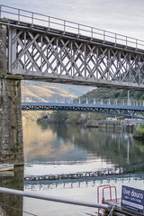 View at the Douro river on Pinhao city with bridges and nice reflection on water background