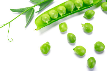 Fresh green peas pods and green peas with sprouts on white background in close-up