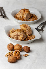 two portions of walnut ice cream