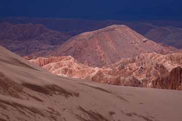 Fototapeta na wymiar View of the landscape of the Atacama Desert. The rocks of the Mars Valley (Valle de Marte) and Cordillera de la Sal, Atacama Desert, Chile