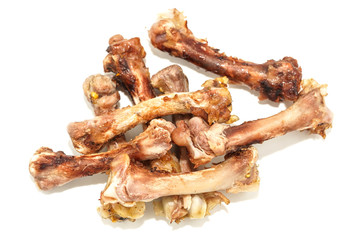 Small bones on a white background. food scraps. chicken bones