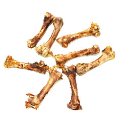 Small bones on a white background. food scraps. chicken bones