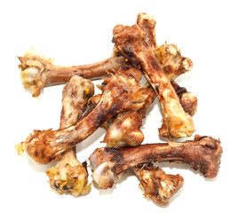 Small bones on a white background. food scraps. chicken bones