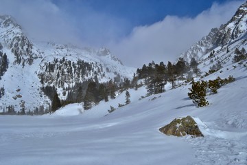 Fototapeta premium Popradske pleso in winter. Sunny day, white clouds, beautiful mountains. High Tatras, Slovakia.