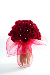 Red Roses in a Vase against a White Backdrop