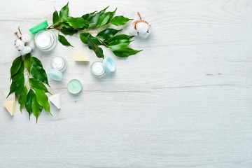 Natural face cream. Face Care. On a white wooden background. Flat lay.