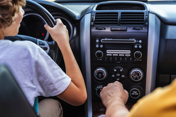 Father with his son sitting in the car