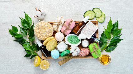Body, face and hair care. Natural anti-aging cosmetics. On a white wooden background. Flat lay.