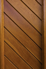 Wooden background in the form of boards arranged at an angle of 45 degrees