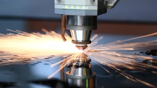laser cutting. Metal machining with sparks on CNC maching