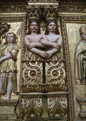 Obraz premium Two Men With Entangled Arms, Carved Wood, Tibaes Monastery, Portugal