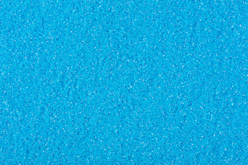 Fototapeta na wymiar Glitter background, shiny texture in gentle blue tone for your holiday desktop.