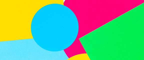 Texture background of fashion papers in memphis geometry style. Yellow, blue, green, pink colors. Top view, flat lay