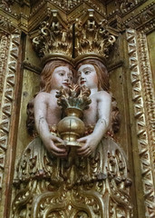 Fototapeta na wymiar Two Women Holding Vase, Carved Wood, Tibaes Monastery, Portugal 
