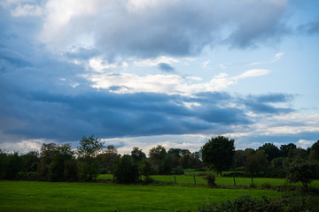 threatening cloud formations  in the sky from the coming storm, while the blue of the sky is still visible