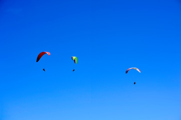 Paragliders in full flight over volcanoes of Puy de Dome in the central massif near Clermont-Ferrand