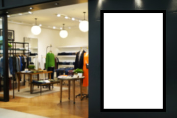 Ads. blank billboard or digital advertising light box for your text message or media content with blurred image popular fashion clothes shop showcase in shopping mall, commercial, marketing concept