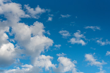 Naklejka na ściany i meble Nature background of cumulus clouds, blue sky and white clouds
