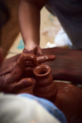 hands of potter at work