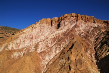 Mineral streaks and sediments in a old abandoned quarry