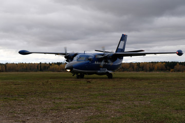 Fototapeta na wymiar An aircraft L-410 is on a runway.