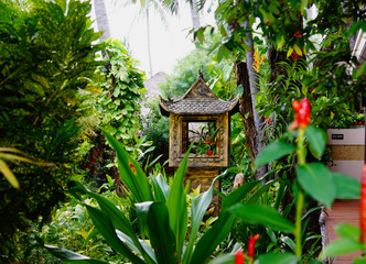 Fototapeta na wymiar Garden in Vietnam. Pagoda in the green 