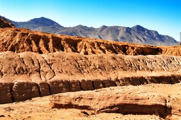 Sediments, rock formations and mineral streaks in an old abandoned quarry