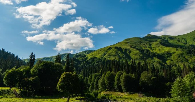 Time lapse with a beautiful view of the highlands with green meadows, beautiful mountain landscape