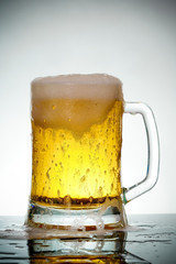 glass of beer with foam