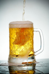 glass of beer with foam