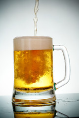 glass of beer with foam