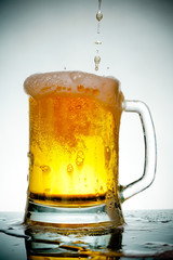 glass of beer with foam