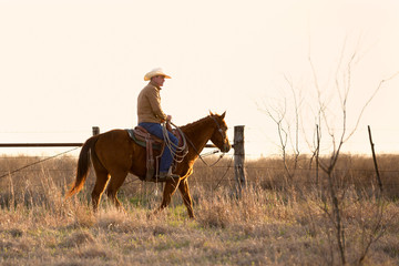 Cowboy preparing to round up cattle