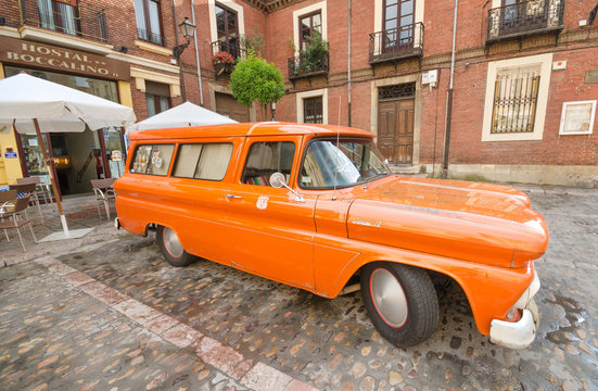 LEON, SPAIN - AUGUST, 22: Orange 1960 Chevy Apache truck car showed in the exterior of a restaurant in Leon, Spain on August 22, 2014.